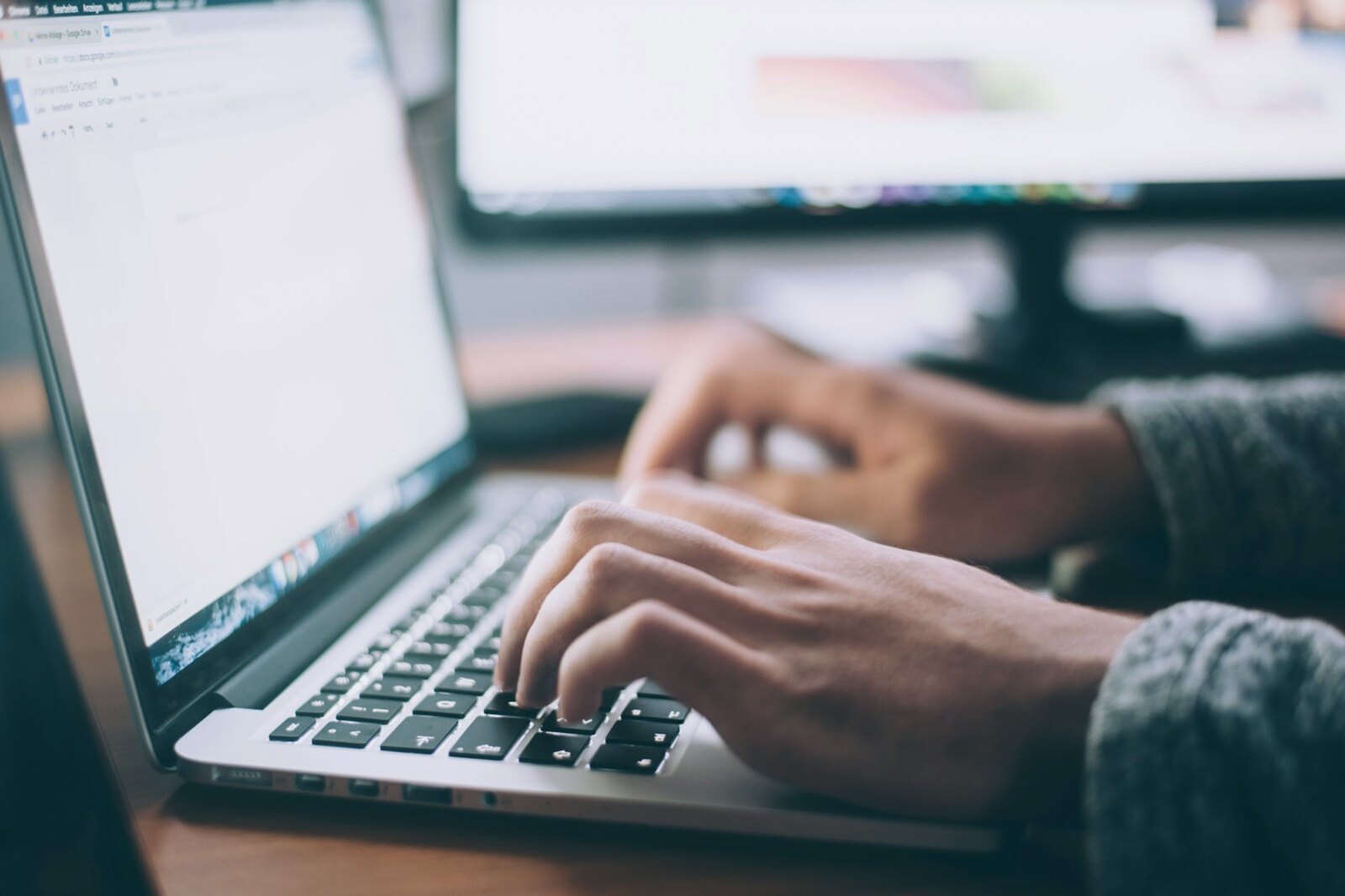 Professional working through an online job search on a laptop
