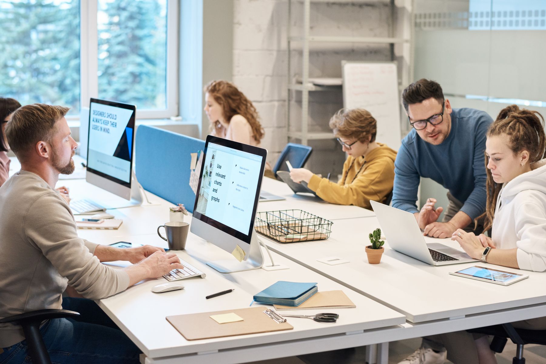 Security team collaborating at computers