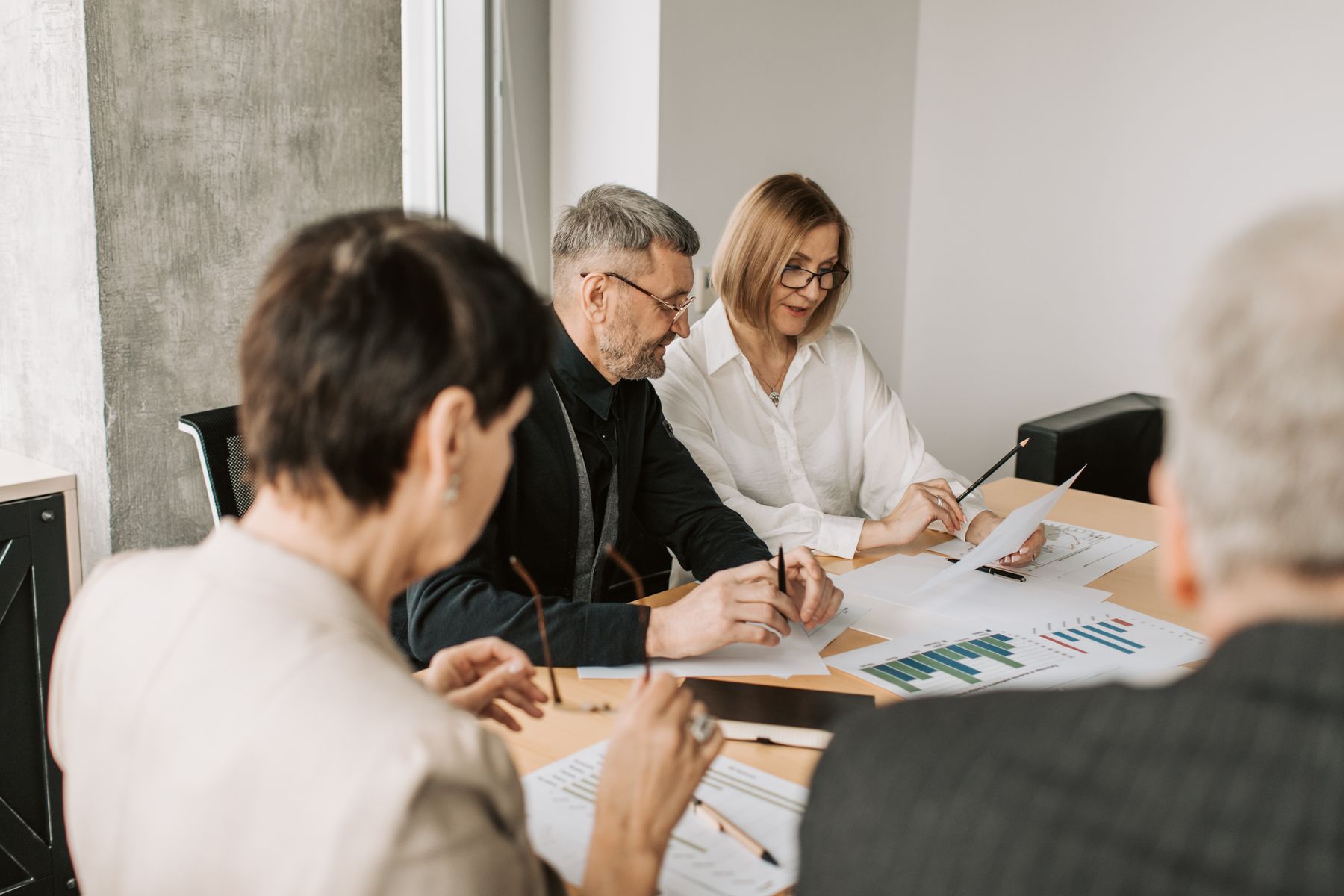 Professionals reviewing governance documents
