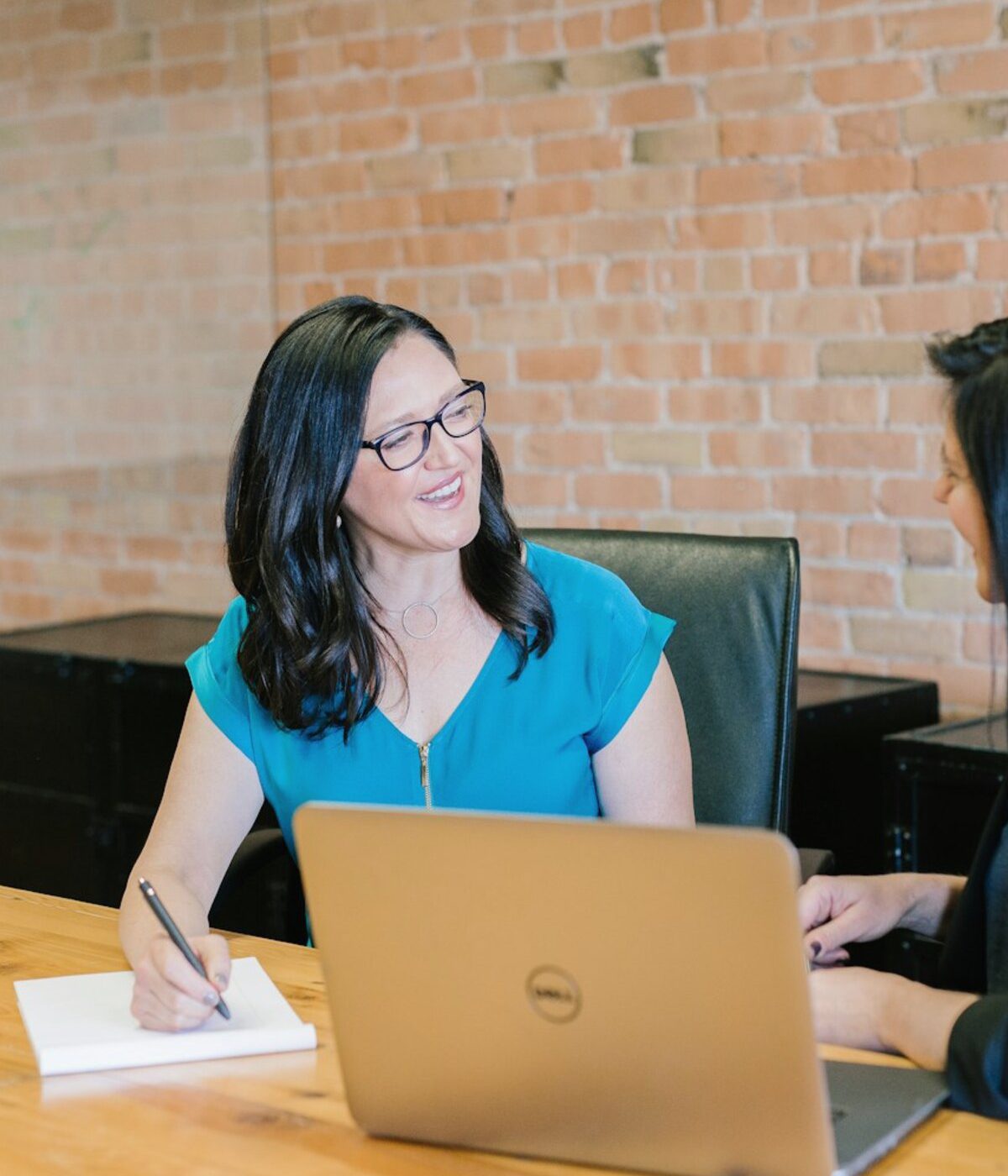Senior search consultants discussing a specialist hiring brief